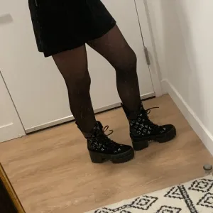 Black velour platform lace up heeled boots
