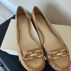 Coach Gold leather flats