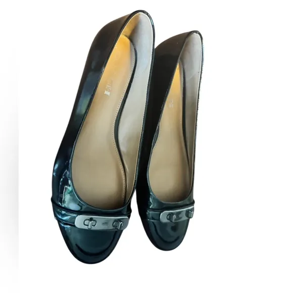 COACH Oswald Black Patent Leather Ballerina Flats with Metal Buckle Accent.