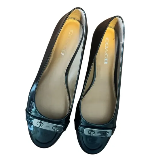 COACH Oswald Black Patent Leather Ballerina Flats with Metal Buckle Accent.