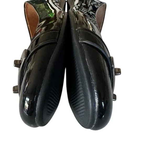 COACH Oswald Black Patent Leather Ballerina Flats with Metal Buckle Accent.