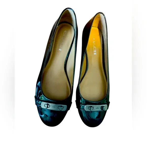 COACH Oswald Black Patent Leather Ballerina Flats with Metal Buckle Accent.