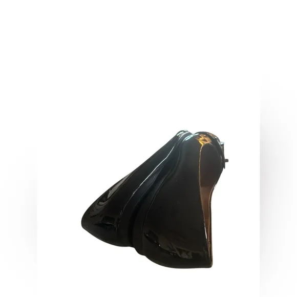 COACH Oswald Black Patent Leather Ballerina Flats with Metal Buckle Accent.