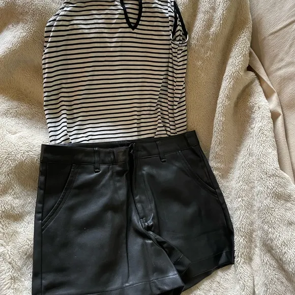 Design by Korea, approx 28” NWOT black synthetic leather short w/ front pockets.