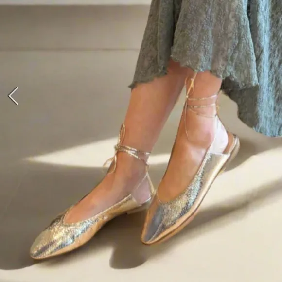 Elegant snakeskin lace up flats