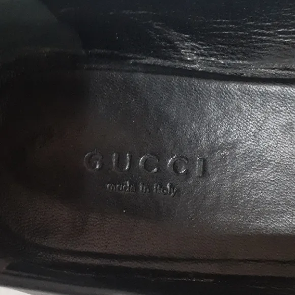 Gucci Black Leather Flats with Silver Buckle.