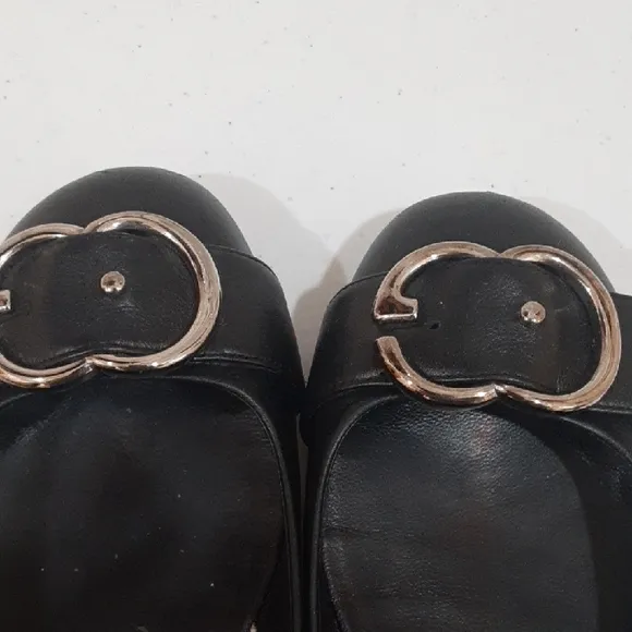 Gucci Black Leather Flats with Silver Buckle.