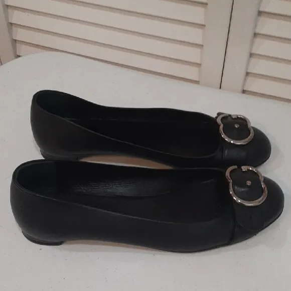Gucci Black Leather Flats with Silver Buckle.