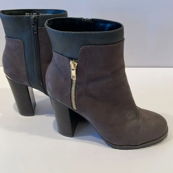 Juicy couture heeled boots in a size 8 medium with approximately a 4 inch heel