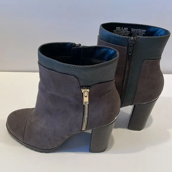Juicy couture heeled boots in a size 8 medium with approximately a 4 inch heel
