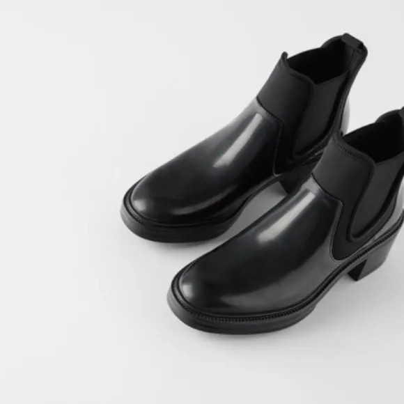 TECHNICAL HEELED ANKLE BOOTS WITH TREADED SOLES