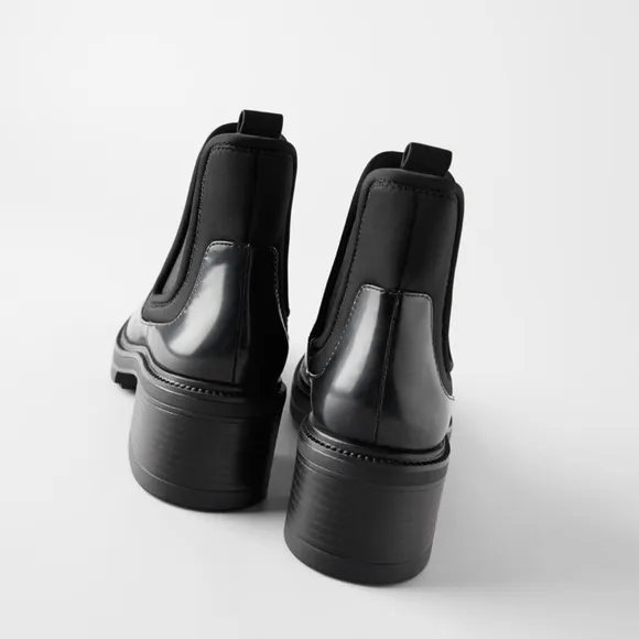 TECHNICAL HEELED ANKLE BOOTS WITH TREADED SOLES