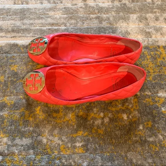 Tory Burch quilted leather flats in burnt orange