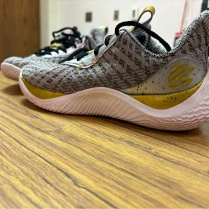 Under Armour Corry Young Wolf Gray and Gold Athletic Shoes