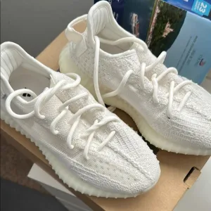 Yeezy White Knit Athletic Shoes with Streamlined Silhouette